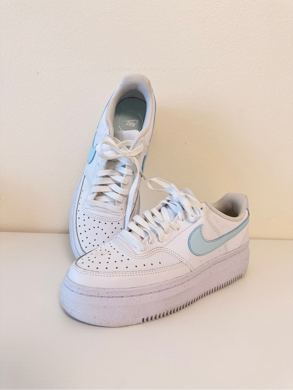 Nike Womenβs White Leather Sneakers with Pale Blue Swoosh Size 9